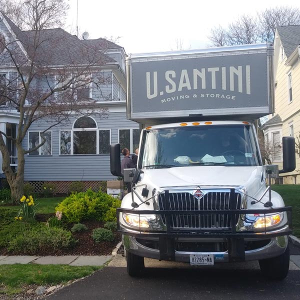 A moving truck drives across Queens, NY