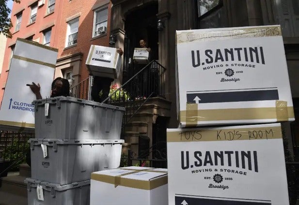 U.Santini professionals moving a large amount of clothes in New York City
