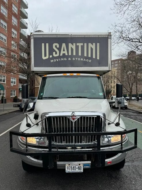 Front view of U.Santini Inc. Moving & Storage truck in New York City 
