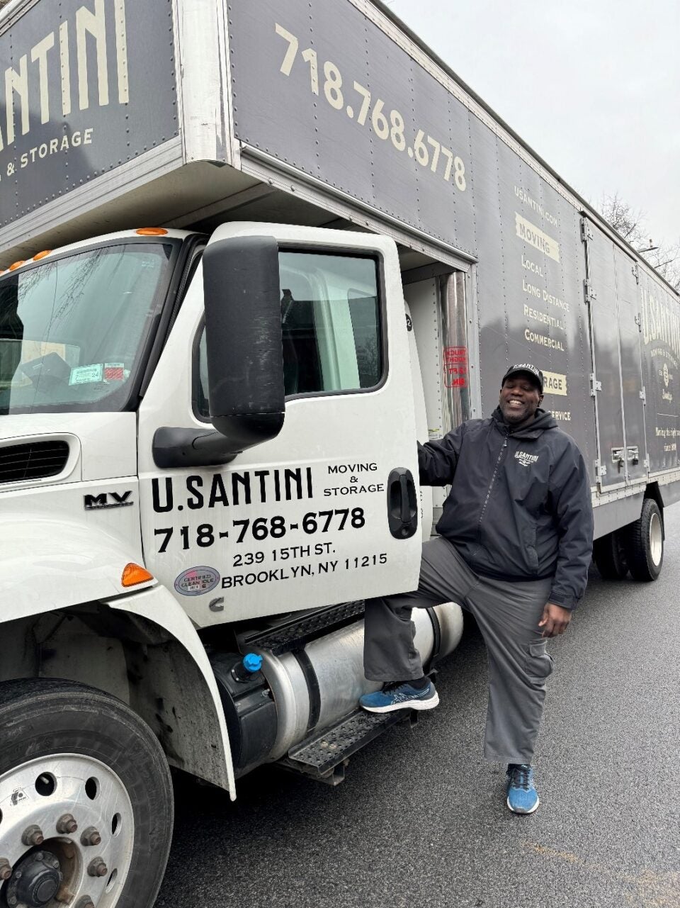 U.Santini worker smiling next to truck in Bensonhurst, Brooklyn, New York