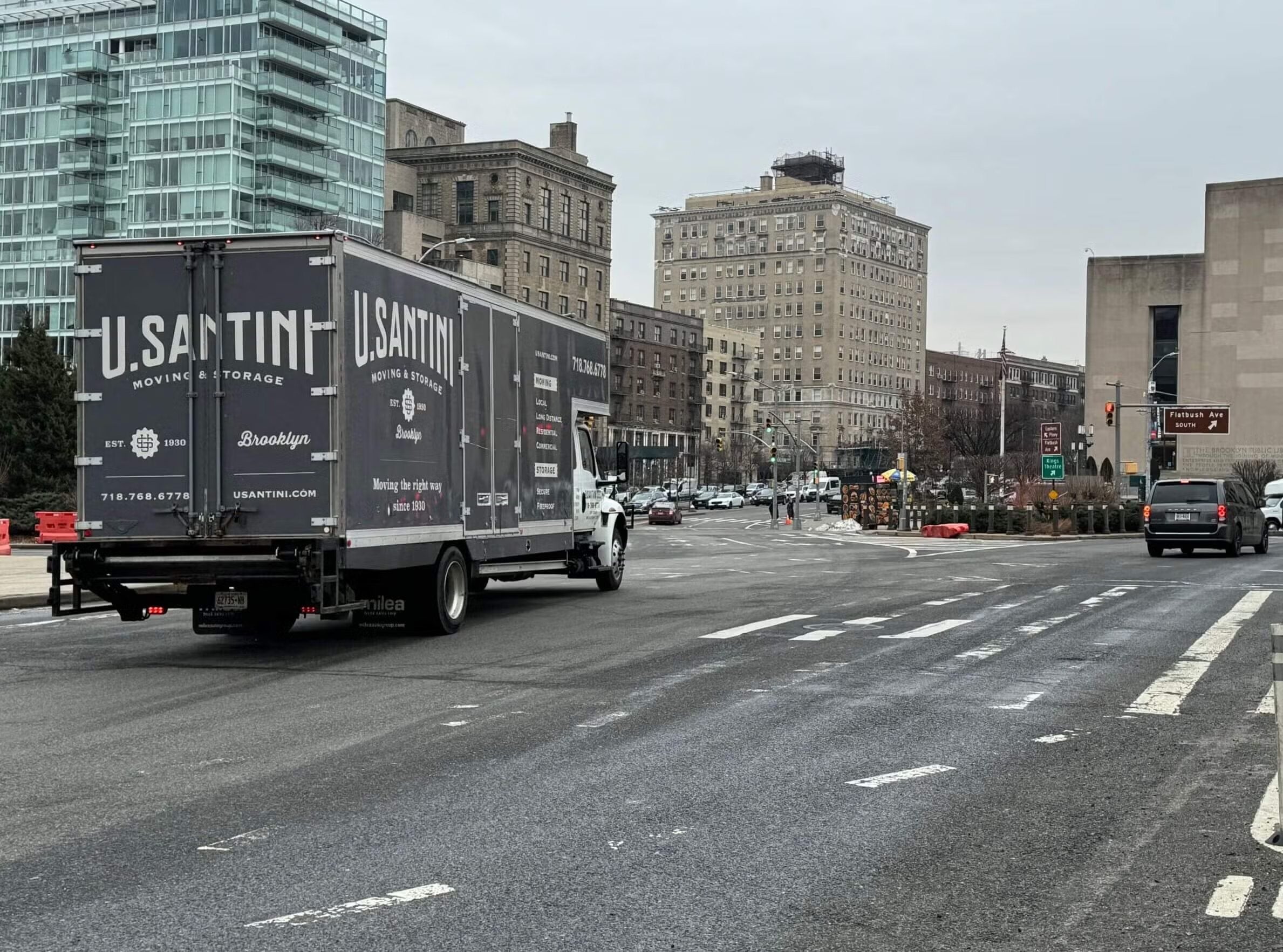 U.Santini truck moves down buys streets of Brooklyn, New York
