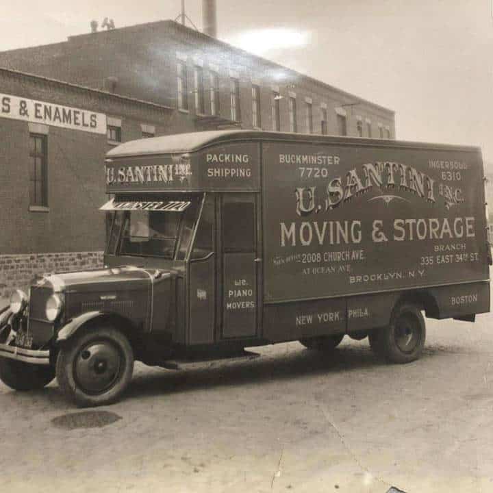 A historic black-and-white photograph of a U. Santini Inc. moving truck displaying packing, shipping, and piano moving services, with the Brooklyn main office address at 2008 Church Avenue